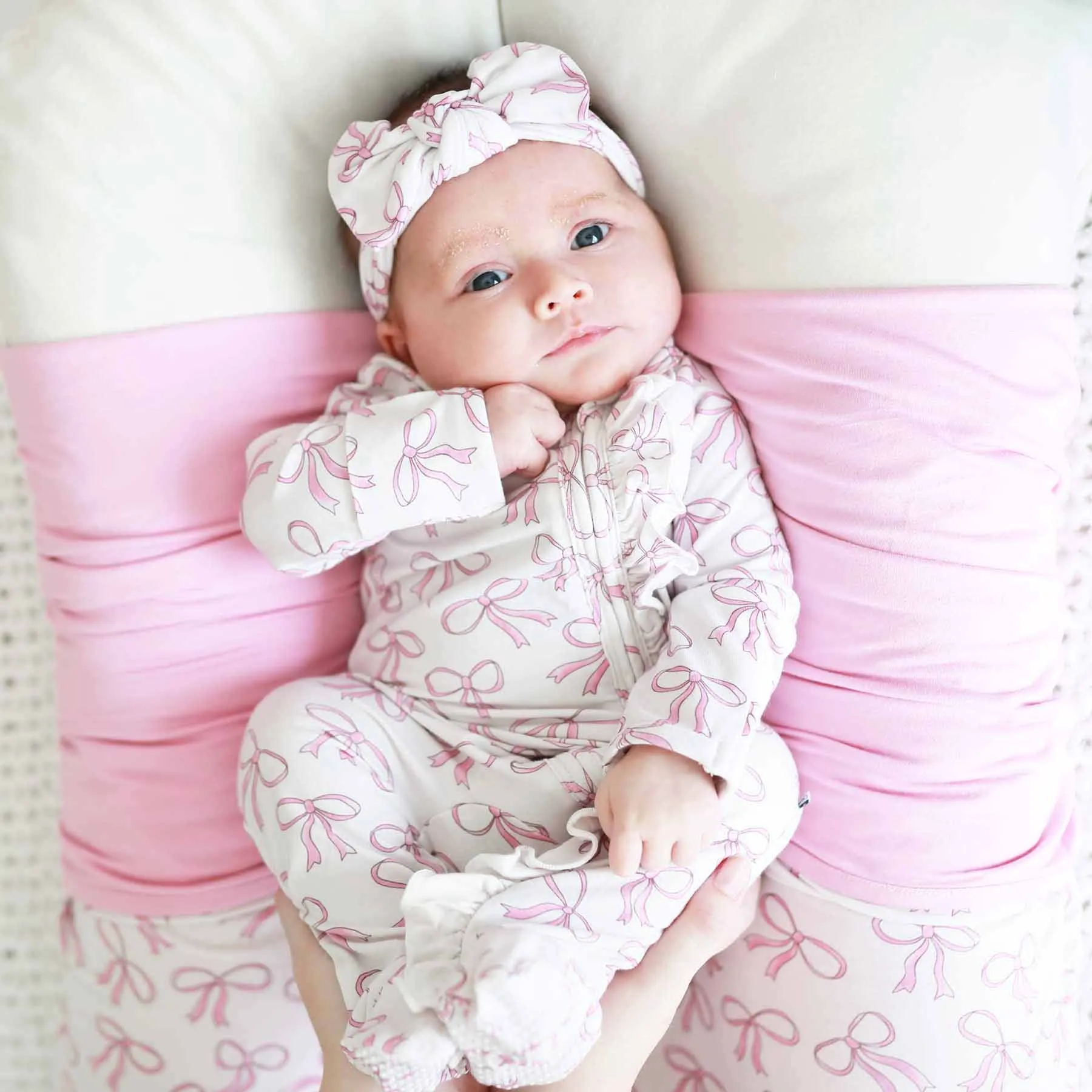 Blushing Bows Ruffle Zipper Footie